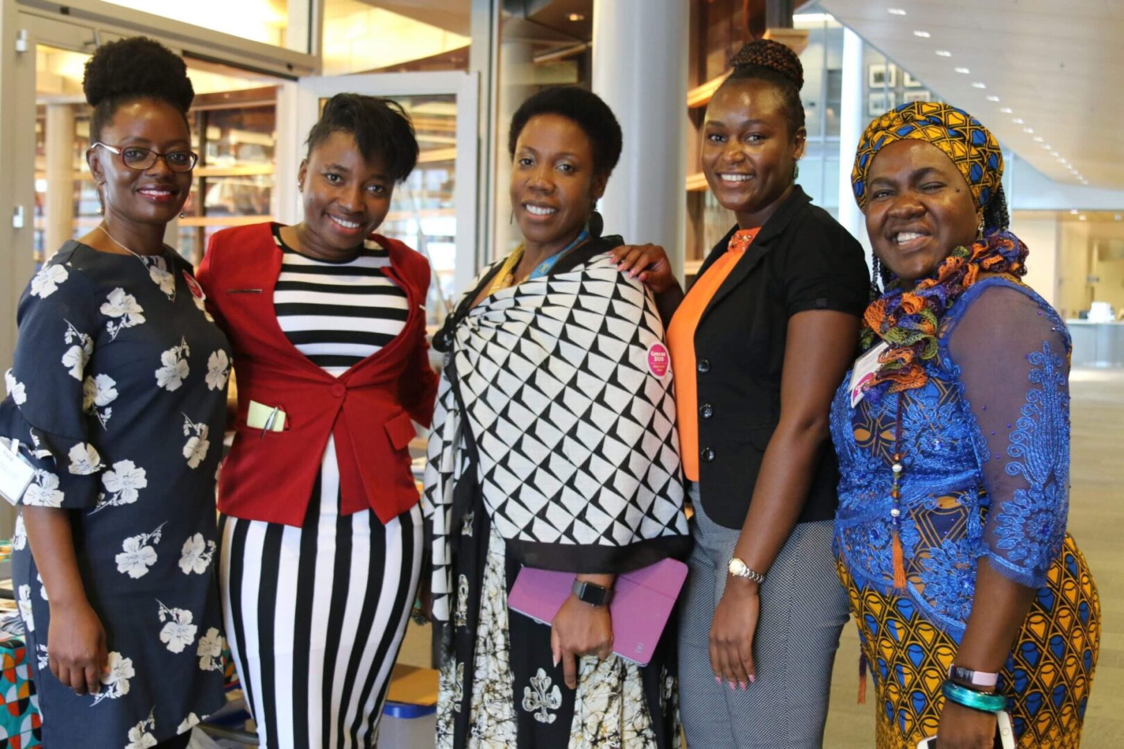 A group of women standing next to each other.